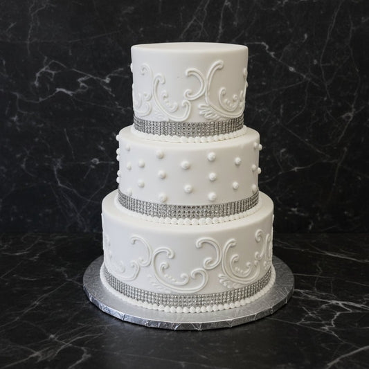 Elegant White Scroll Wedding Cake